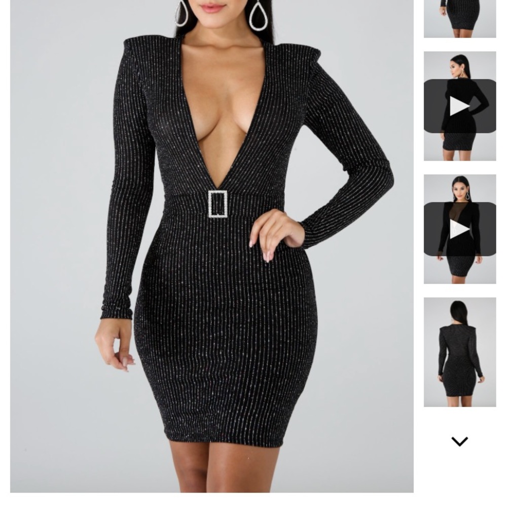 Low V-cut glittery black dress with shoulder pads.
